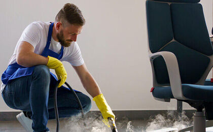 Commercial cleaning technician working in an office space