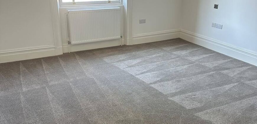 Empty bedroom with freshly cleaned carpet ready for a move-in